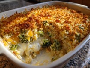 Close-up of a creamy, cheesy broccoli rice casserole with a crunchy, golden breadcrumb topping.